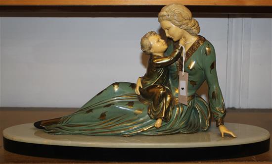 Art Deco painted spelter and ivory figure of a mother and child,